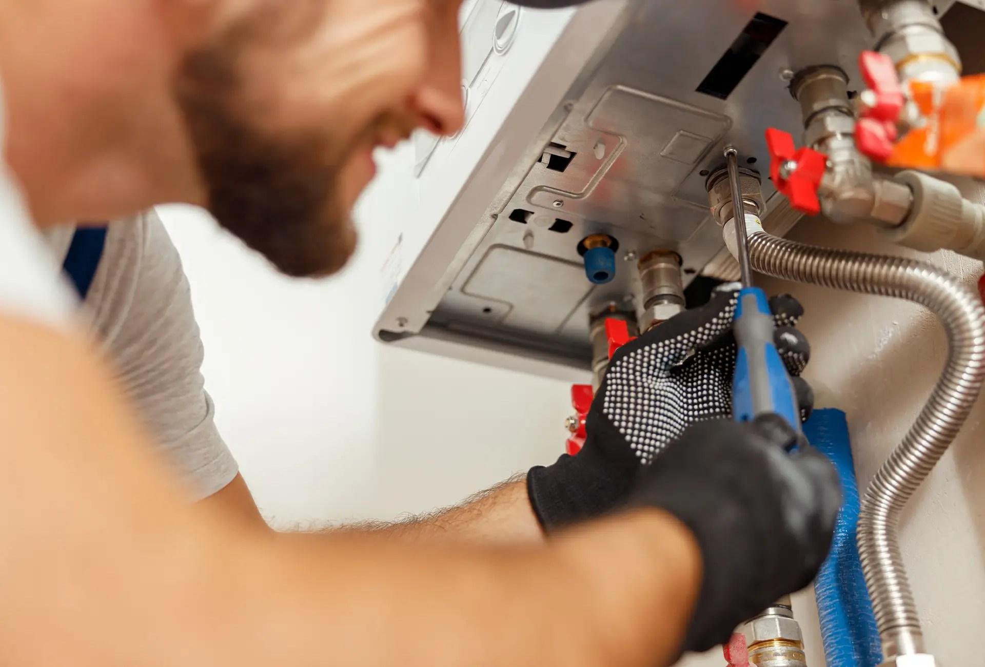 Engineer diagnosing a fault on a central heating boiler