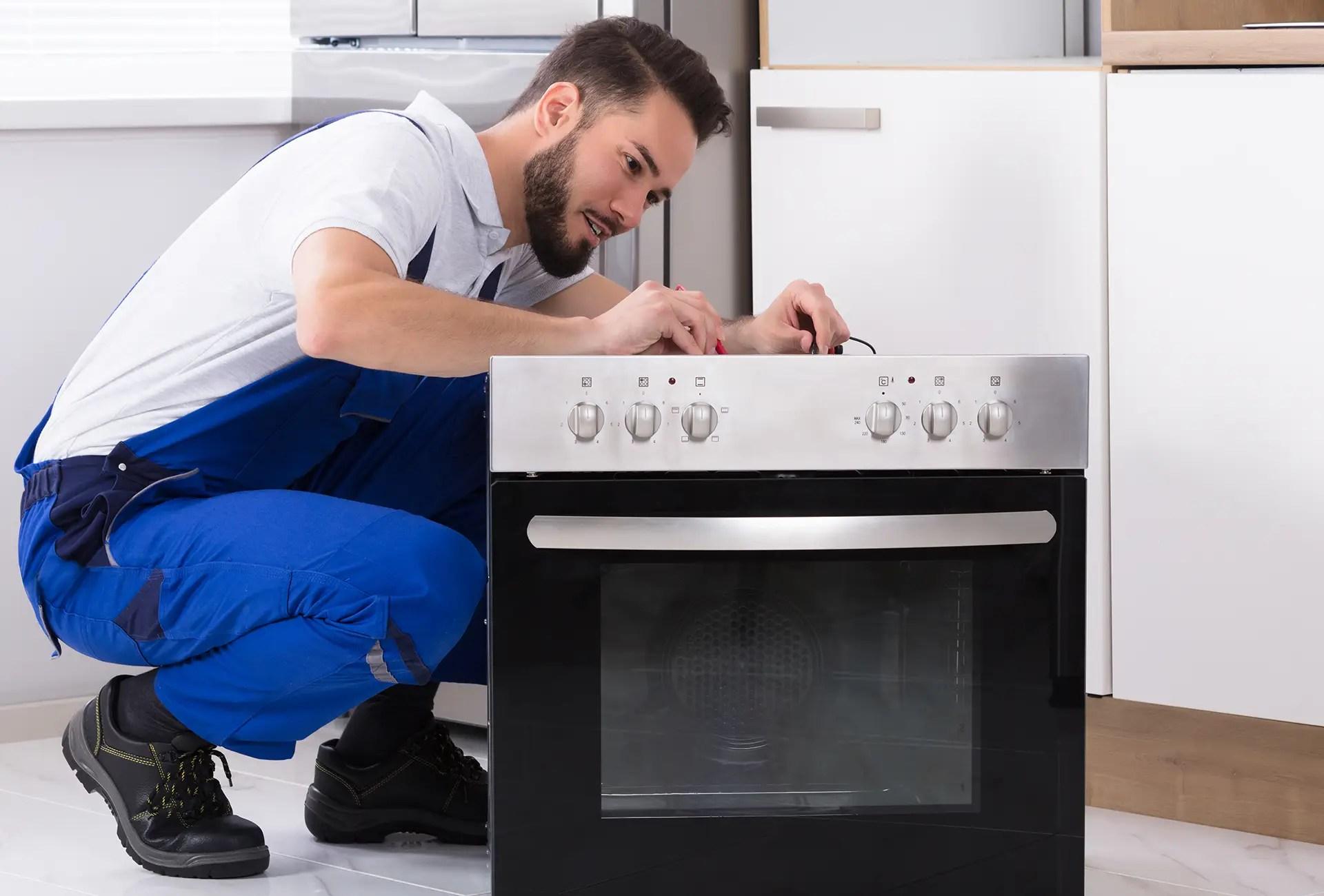 Electrician connecting a new kitchen appliance