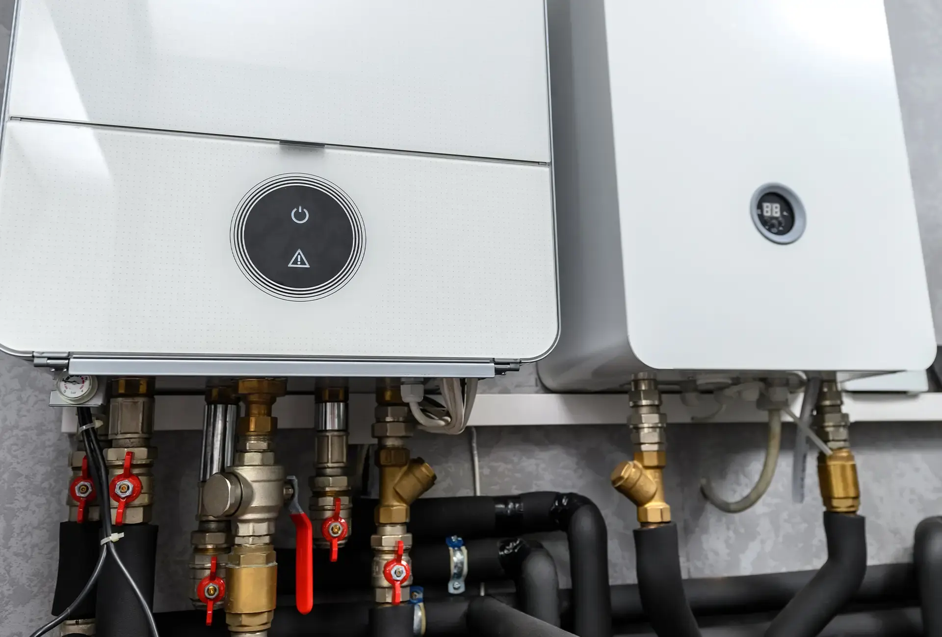 Wall-mounted domestic water-heating equipment with connected pipework and controls